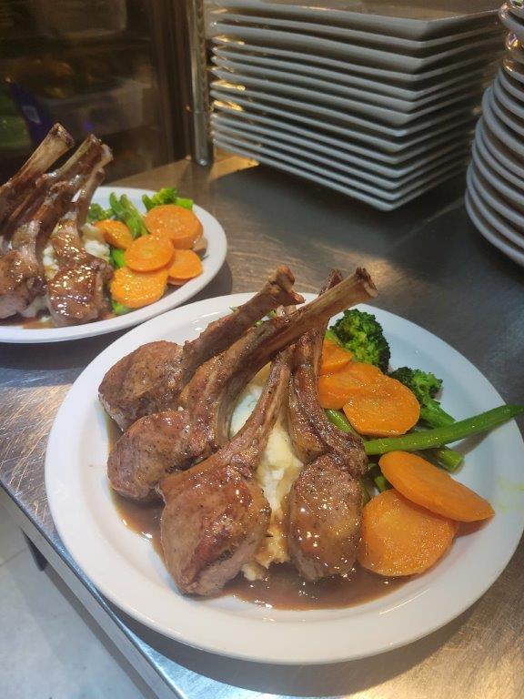 A plate of food with meat and vegetables on it.