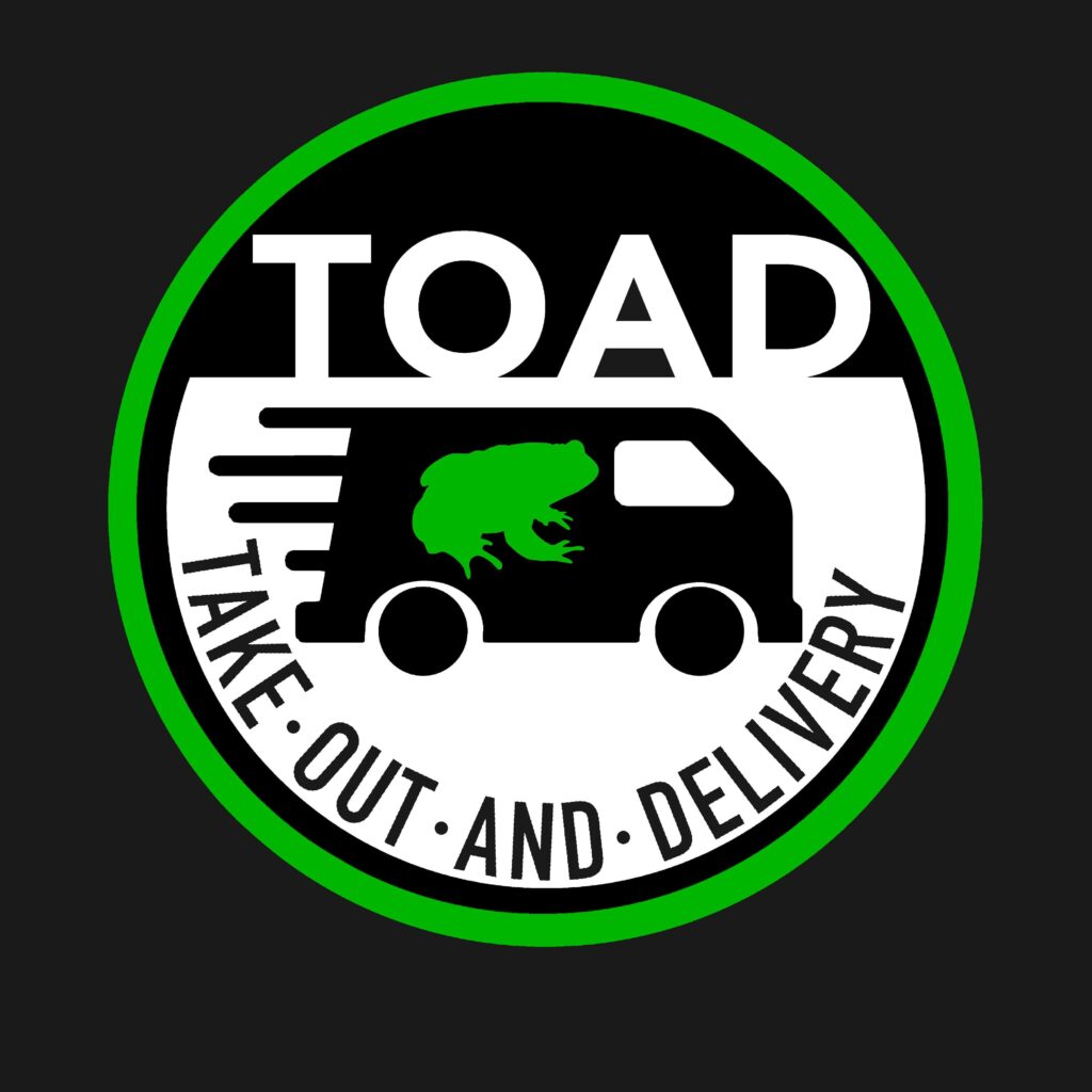 A green and white truck with the words " toad take-out-and delivery ".