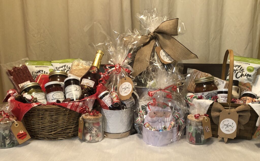 A table with several baskets of food and drinks.