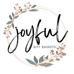 A logo of the word joyful with leaves around it.