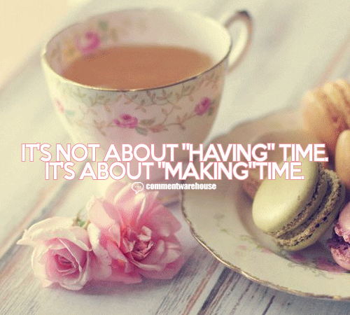 A cup of tea and some cookies on a table.