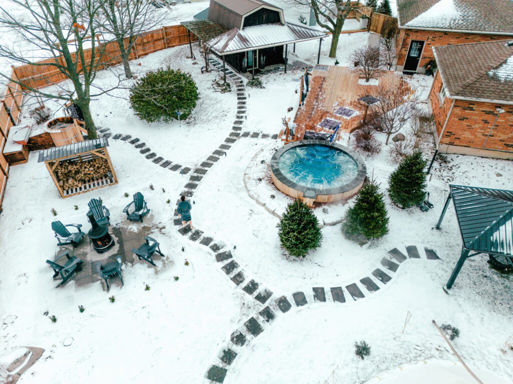 A view of an outdoor pool and patio area.